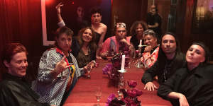 Tracey Moffatt (with hand raised) at a party with Biennale artists in March before the shutdown.