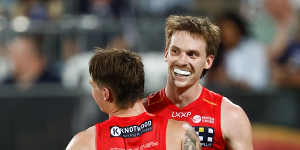 Humphrey (left) and Noah Anderson celebrate another Suns goal.