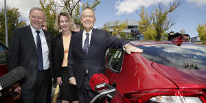 Anthony Albanese,Labor candidate for Canberra Alicia Payne and Bill Shorten view an electric car at a charging station.