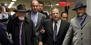 Harvey Weinstein,centre,is accompanied by attorney Arthur Aidala,right,as he arrived at court for his trial.