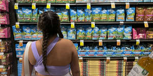 A shopper looks at the macadamia delicacies on offer in a Honolulu shop.