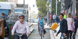 Cyclists using a bike lane in La Trobe St.