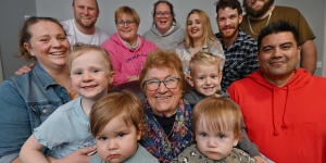Joan Graham with some of her biological children and former foster children and their offspring.