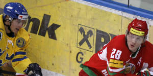 Konstantin Koltsov (in red) was an international ice hockey player before he started dating Aryna Sabalenka.