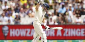 England captain Joe Root punches the air in frustration. 