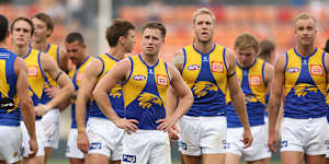 SYDNEY,AUSTRALIA - APRIL 06:Eagles players look dejected as they walk from the field after defeat during the round four AFL match between GWS Giants and West Coast Eagles at ENGIE Stadium,on April 06,2025,in Sydney,Australia. (Photo by Mark Metcalfe/AFL Photos/via Getty Images)
