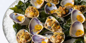 Clams casino features Goolwa pipis baked on their half-shells under crunchy,garlicky guanciale-infused crumbs.