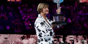 Margaret Court with her replica trophy during Monday's ceremony to mark the 50th anniversary of her grand slam win.