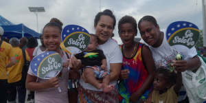 Junita Javi (right) with her four children outside the Pacific Games stadium. 