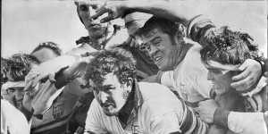 Barry"Tizza"Taylor,second from right,protects Ken Taylor (no relation) in a rugby union match in 1972. 