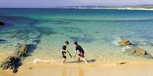 Sea change ... children play at Mimosa Rocks.