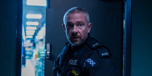 Martin Freeman as troubled Liverpool police office Chris Carson.