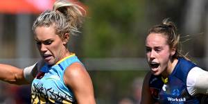 The Lions’ Orla O’Dwyer speeds away against the Crows.