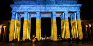 The Brandenburg Gate is lit in the blue and yellow colours of the Ukrainian national flag in solidarity with Ukraine and its people in Berlin,Germany.
