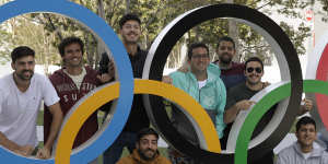 Tourists have their photo taken with the Olympic rings in Tokyo at the weekend. 