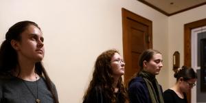 Benedictine College students,from left,Madeline Hays,Niki Wood,Ashley Lestone and Hannah Moore gather for evening prayers in a room which they converted to a chapel in the house they share in Atchison,Kansas. 
