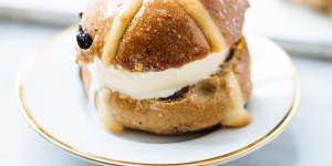 Use a cookie cutter to cut out discs of ice-cream for hot cross bun ice-cream sandwiches.