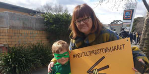 Protesters Kersti Skinner and four-year-old Jude,aka Market Man,at a demonstration at Preston Market on Saturday.