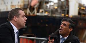 Britain’s Prime Minister Rishi Sunak,right,campaigns at the Port of Nigg,Scotland,with the leader of the Scottish Conservative party,Douglas Ross.