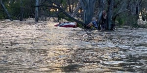 A woman aged in her 70s is lucky to be alive after she was swept away in flood waters in Elmore.
