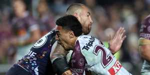 Lehi Hopoate of the Sea Eagles is tackled by Nelson Asofa-Solomona of the Storm.