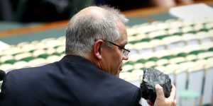 Then treasurer Scott Morrison holds up a lump of coal in Parliament in February 2017. 