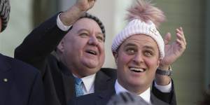 Liberal MP Tim Wilson (right) poses for a photo with a beanie during a brain cancer event at Parliament House