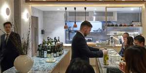 Allta’s timber slats arch over diners like a blond wood Hokusai wave.