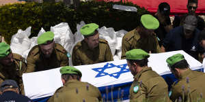 Soldiers carry the coffin of IDF soldier Dor Zimel during his funeral on Monday in Even Yehuda,Israel. Zimel was wounded in a Hezbollah drone attack in on Thursday,and later succumbed to his wounds.