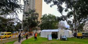 Victorian Health staff prepare a COVID testing site at the Flemington public housing tower in Melbourne in August.