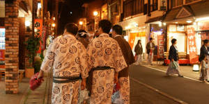 Strolling between onsens in Osaka.