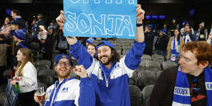 Kangaroos fans hold a sign in support of club president Sonja Hood.