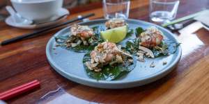 Miang kham,large betel leaves with a sweet,sour,spicy mix of prawns,jicama,coconut and peanuts.