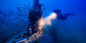 Deep blue:Maritime archaeologist Matt Carter diving on the wreck of the Japanese midget submarine off Bungan Head.