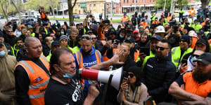 CFMEU boss John Setka talks to construction workers before clashes broke out on Monday.
