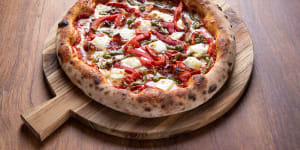 The Faz pizza topped with roasted peppers,pancetta,pesto,mozzarella and feta at Ohana.