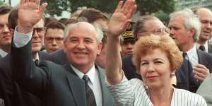 Soviet President Mikhail Gorbachev and his wife Raisa wave to a crowd during their visit in Paris,France,1989.