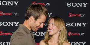 Look of love? Glen Powell and Sydney on the red carpet.