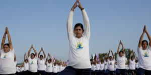 Thousands of people get into a twist for Yoga Day