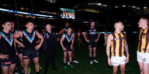 Ken Hinkley and James Sicily exchange words after Port Adelaide’s thrilling win.