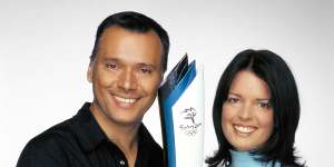 Holmes with Stan Grant ahead of the Sydney Olympics. They married in 2001.