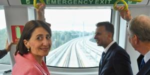 Premier Gladys Berejiklian and Andrew Constance on a driverless metro train undergoing testing in March.