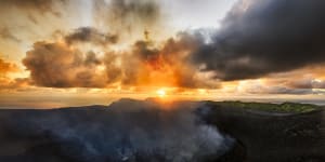 The active volcano at Mount Yasur,erupting at sunrise. 