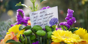Floral tributes outside Korumburra Baptist Church for the mushroom poisoning victims.