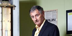 Leonard Kleinrock stands next to a specialised computer — a forerunner to today's routers — that sent the first message over the internet in 1969.