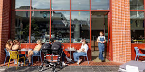The cafe is housed at the base of an apartment building.