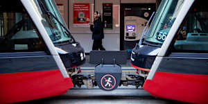 Signage between carriages on the light rail.