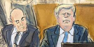 Donald Trump (right) and his lawyer Emil Bove watch a video screen of Stormy Daniels testifying in Manhattan criminal court.