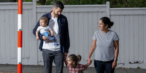 Claire Courtis-Petrusev and Iggy Courtis with their children Rosa and Wilbur at Surrey Hills Primary School pedestrian crossing.