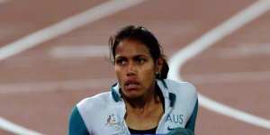 Cathy Freeman takes it in after winning the 400 metres at the Sydney 2000 Olympic Games.